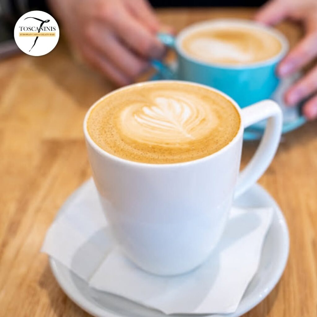 Cafe latte with leaf latte art in a white cup at Toscanini’s coffee shop in Caroline Springs